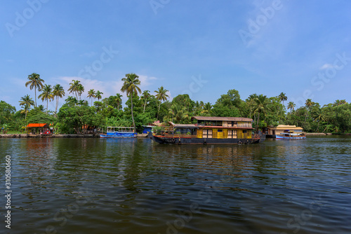 River view and boat in Kerala's Backwaters, India.