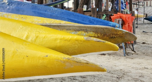 Beautiful view of colorful kayak or canoes at a beach