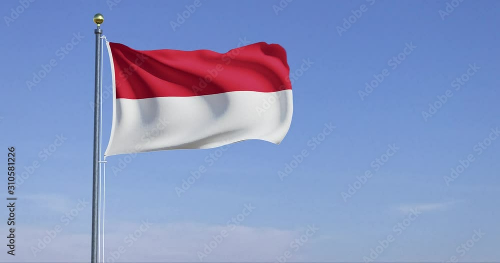 Flag of Indonesia blowing in the wind with blue sky Flag of Indonesia blowing in the wind with blue sky