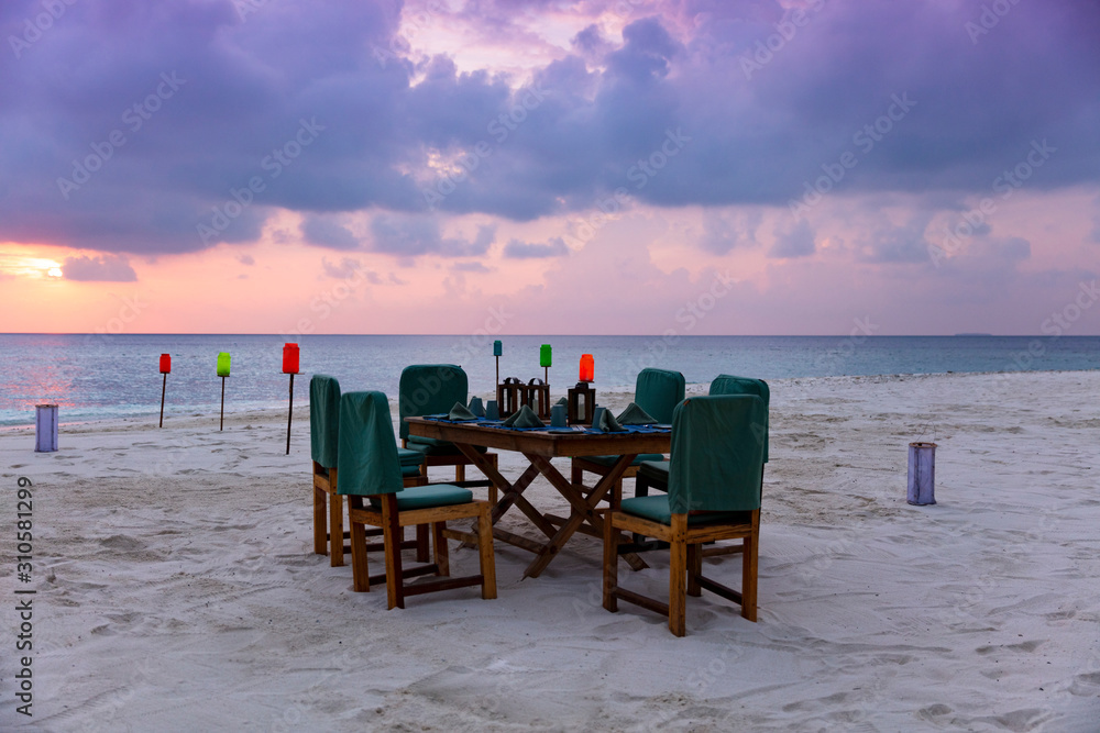 Private luxury dining experience on pristine tropical beach