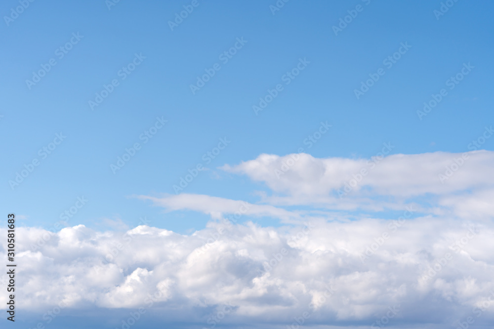 Beautiful cirrus clouds on blue sky on a sunny day background texture