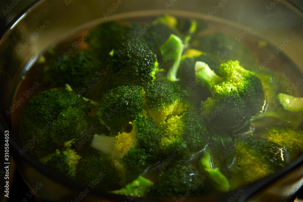 Boiling broccoli in glass cooking pot Boiling broccoli in glass cooking pot