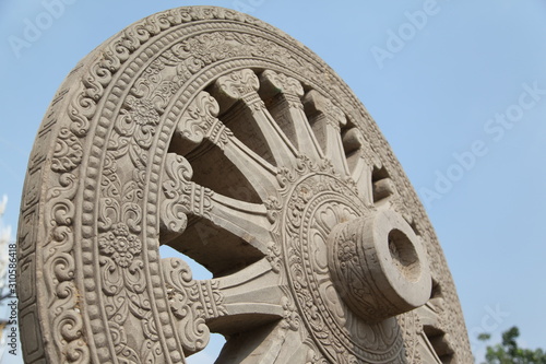 Wheel of Dhamma on blue sky background