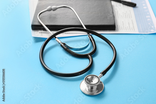Stethoscope, notebook and d...