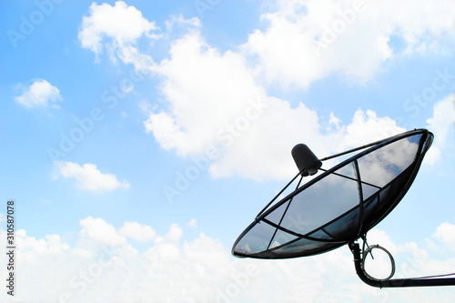 Satellite communication dish with blue sky and cloud