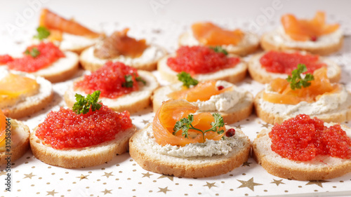 buffet food, dining appetizer snack, canape with salmon and caviar