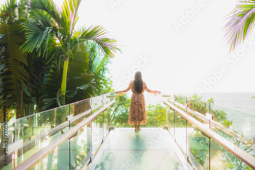 Portrait beautiful young asian women happy smile around outdoorn happy smile relax around tropical beach sea photo