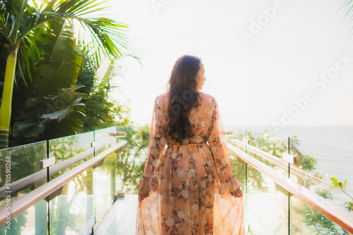 Portrait beautiful young asian women happy smile around outdoorn happy smile relax around tropical beach sea photo