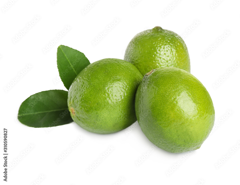 Fresh ripe limes with green leaves isolated on white Fresh ripe limes with green leaves isolated on white