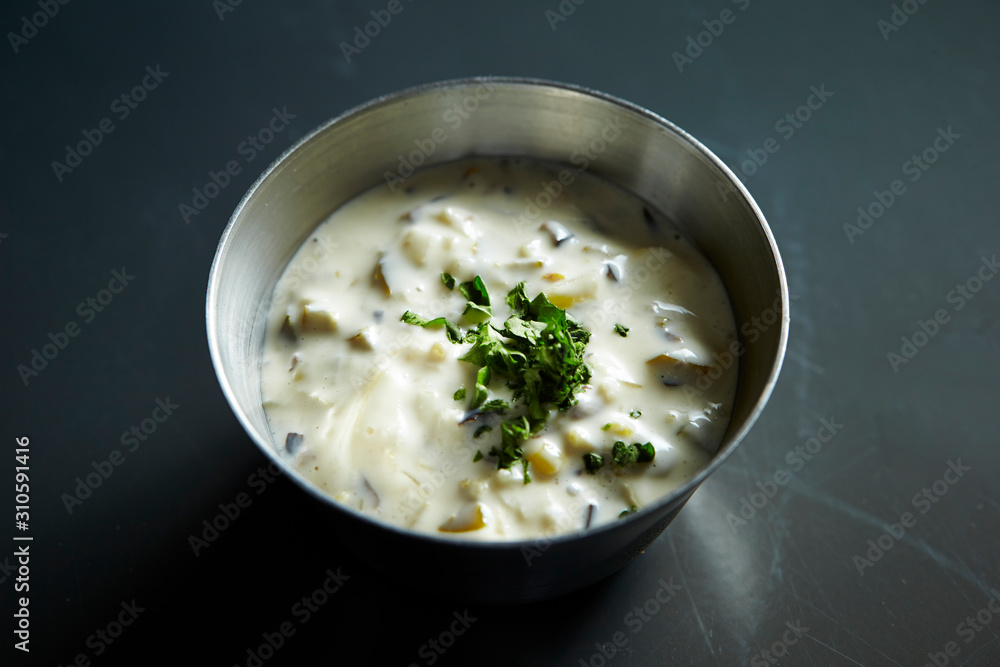 White cream sauce with dried parsley 