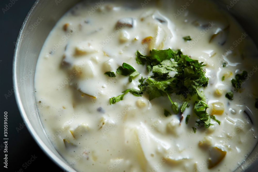 White cream sauce with dried parsley White cream sauce with dried parsley