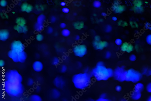 Abstract dark background with blue lights. Bokeh, blur