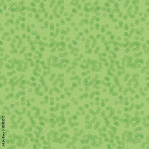 A green abstract seamless vector pattern with overlapping dots ornament. Surface print design.