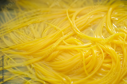 Boiling spaghetti, cooking pasta noodle 