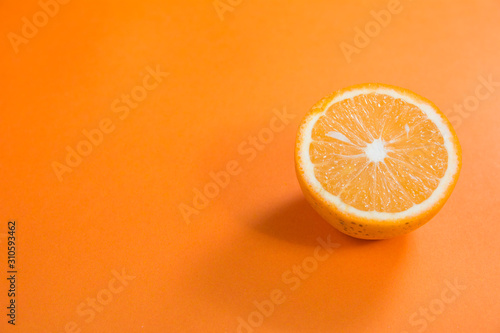 half cut orange side angle top view on orange background for orange products
