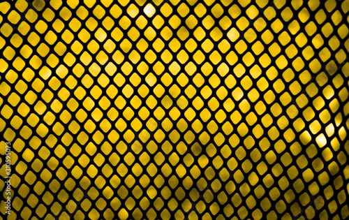 black square Mesh fence pattern on yellow background