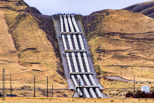 Aqueducts at the south end of San Joaquin Valley, taking pumped water uphill, over the Grapevine, en route to Los Angeles, part of the California State Water Project, California, USA