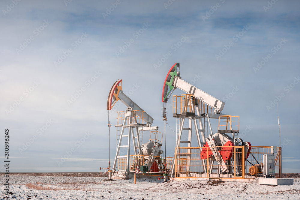 Oil pump jack. Crude oil. Oil pump jack. Crude oil.