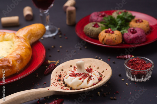 Wallpaper Mural Georgian food on black table. khinkali, phali,  khachapuri with tomatos, adjika and a glass of wine. Torontodigital.ca