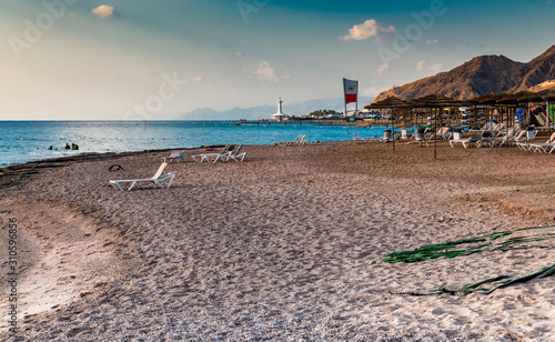 Morning on sandy beach of Eilat - famous tourist resort in the Middle East