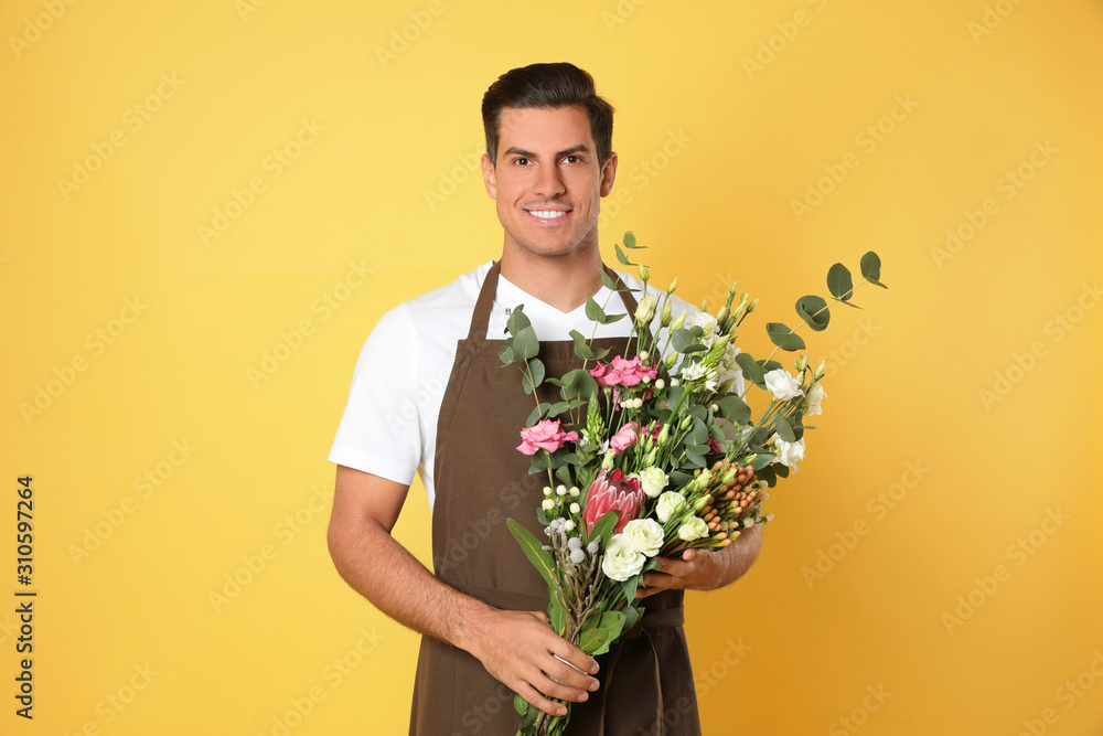 Florist with beautiful bouquet on yellow background Florist with beautiful bouquet on yellow background