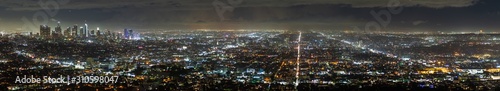 Aerial panoramic night view of Los Angeles metropolitan area; Financial District and the downtown area visible on the left © Sundry Photography