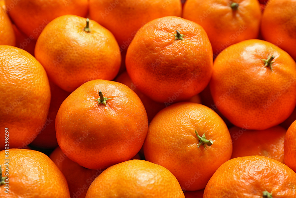 Delicious fresh ripe tangerines as background, closeup Delicious fresh ripe tangerines as background, closeup