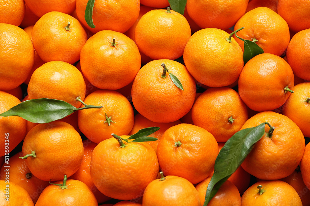 Delicious fresh ripe juicy tangerines as background Delicious fresh ripe juicy tangerines as background