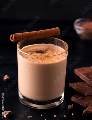 lassi chocolate cold indian drink on black background. vertical image