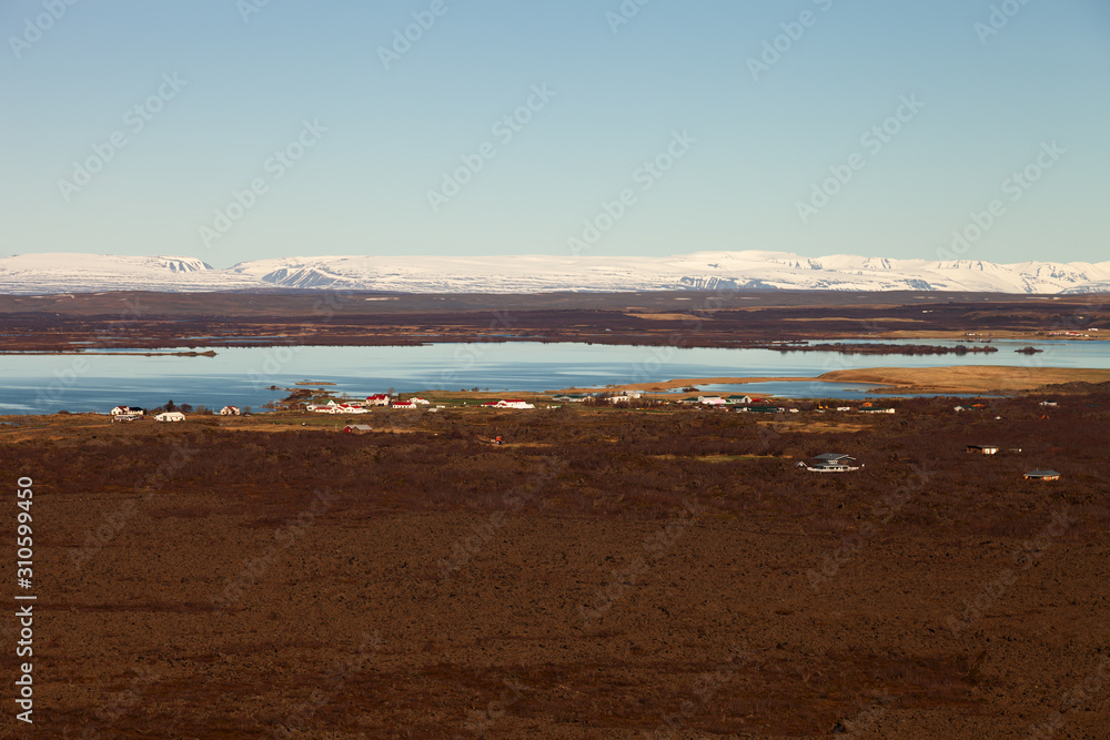View to the small town and snowy mountains in the Iceland