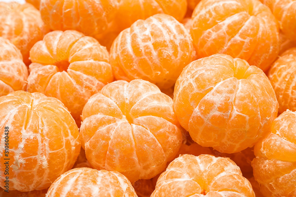 Peeled fresh ripe tangerines as background, closeup Peeled fresh ripe tangerines as background, closeup