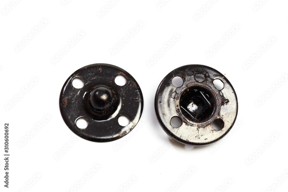 Close up of a group of metal Snap on Buttons on white background - Image Close up of a group of metal Snap on Buttons on white background - Image