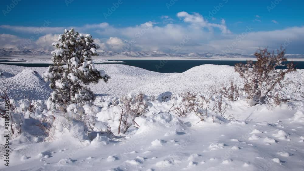 Time Lapse with a camera move of a wintery landscape with Mono Lake in the background. Time Lapse with a camera move of a wintery landscape with Mono Lake in the background.