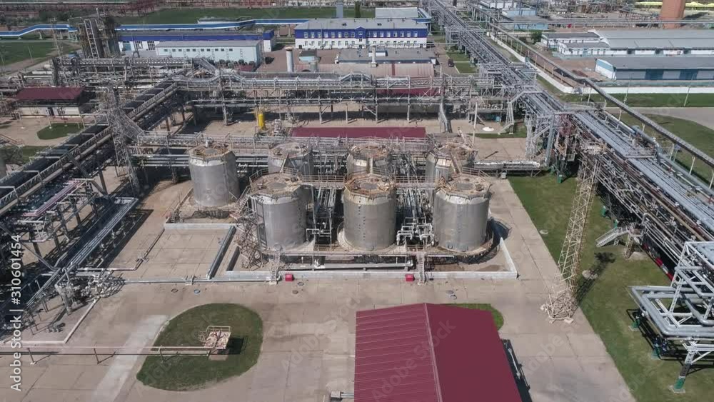 4K Aerial shot from oil tanks and towers in a refinery 4K Aerial shot from oil tanks and towers in a refinery