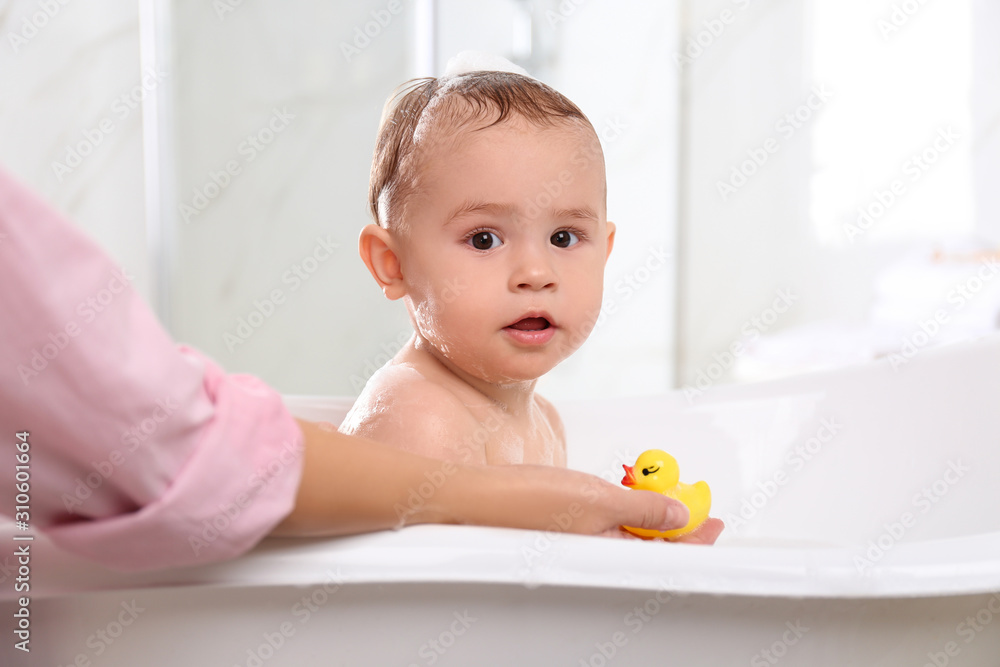 Mother with her little baby in bathroom Mother with her little baby in bathroom