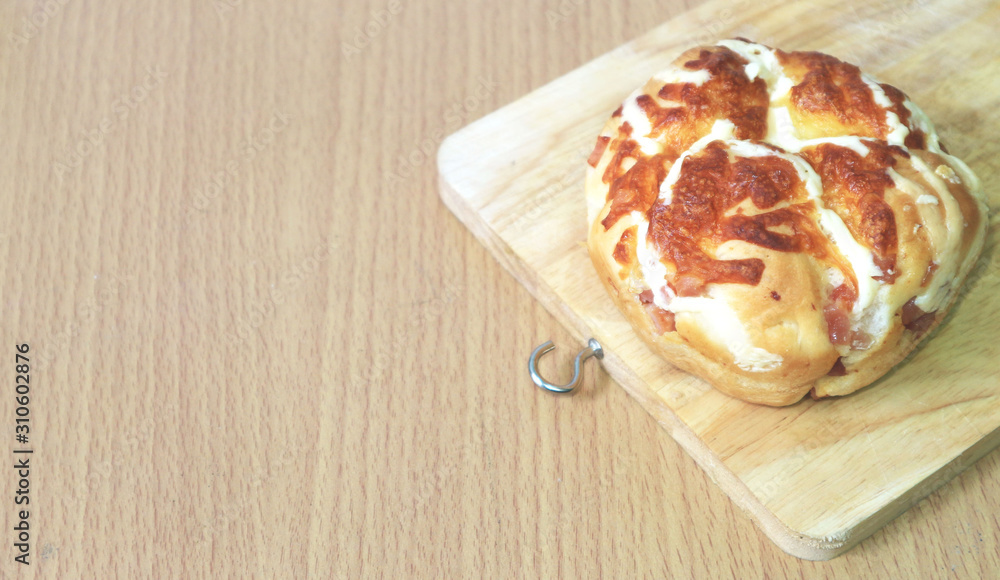 bread with cheese on a wooden floor bread with cheese on a wooden floor