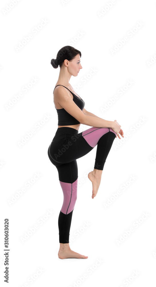 Professional young acrobat exercising on white background Professional young acrobat exercising on white background