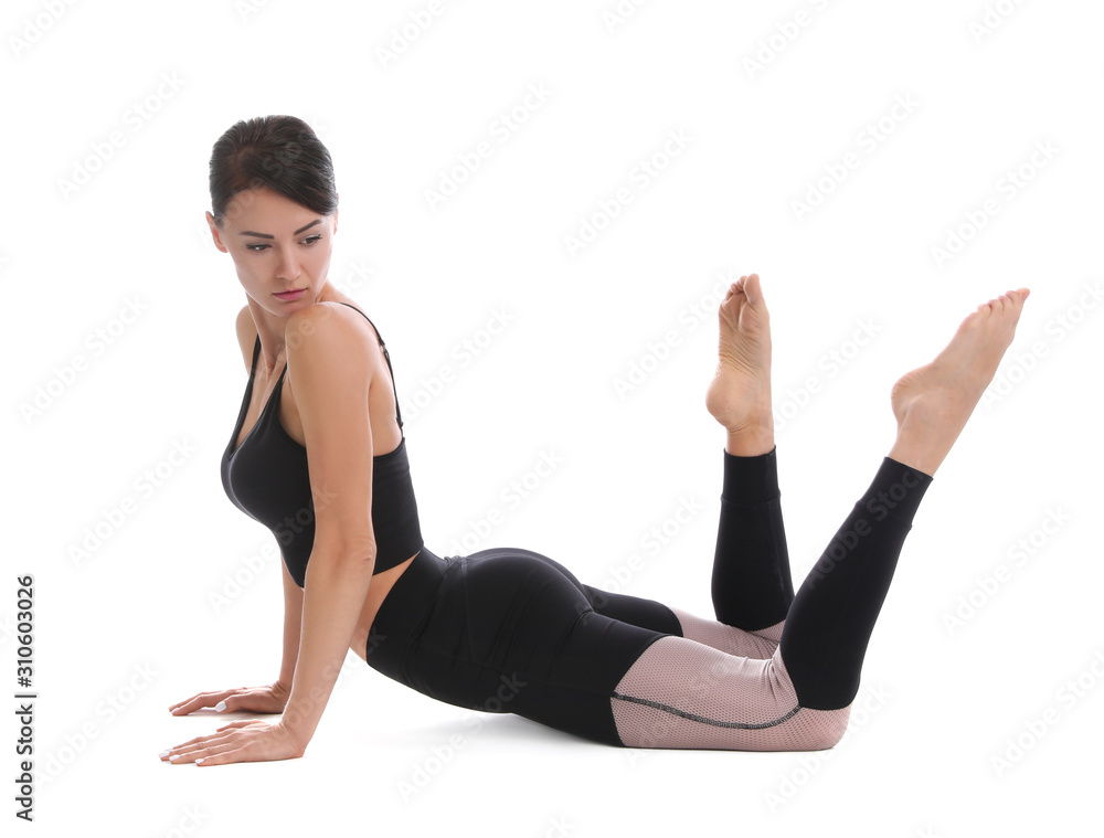 Professional young acrobat exercising on white background Professional young acrobat exercising on white background