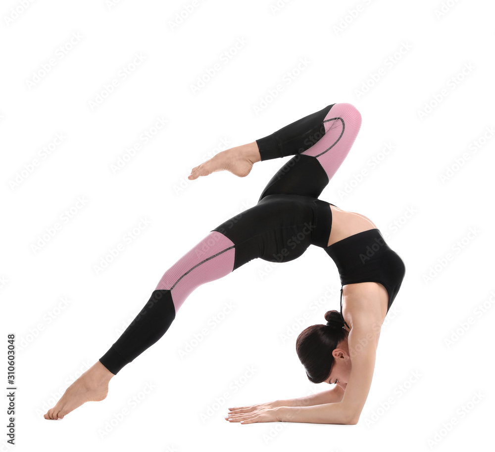 Professional young acrobat exercising on white background