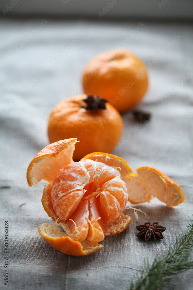 ripe peeled mandarin on a gray background, star anise. For calendar, background ripe peeled mandarin on a gray background, star anise. For calendar, background