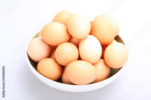 Pile of Eggs in bowl isolated on white