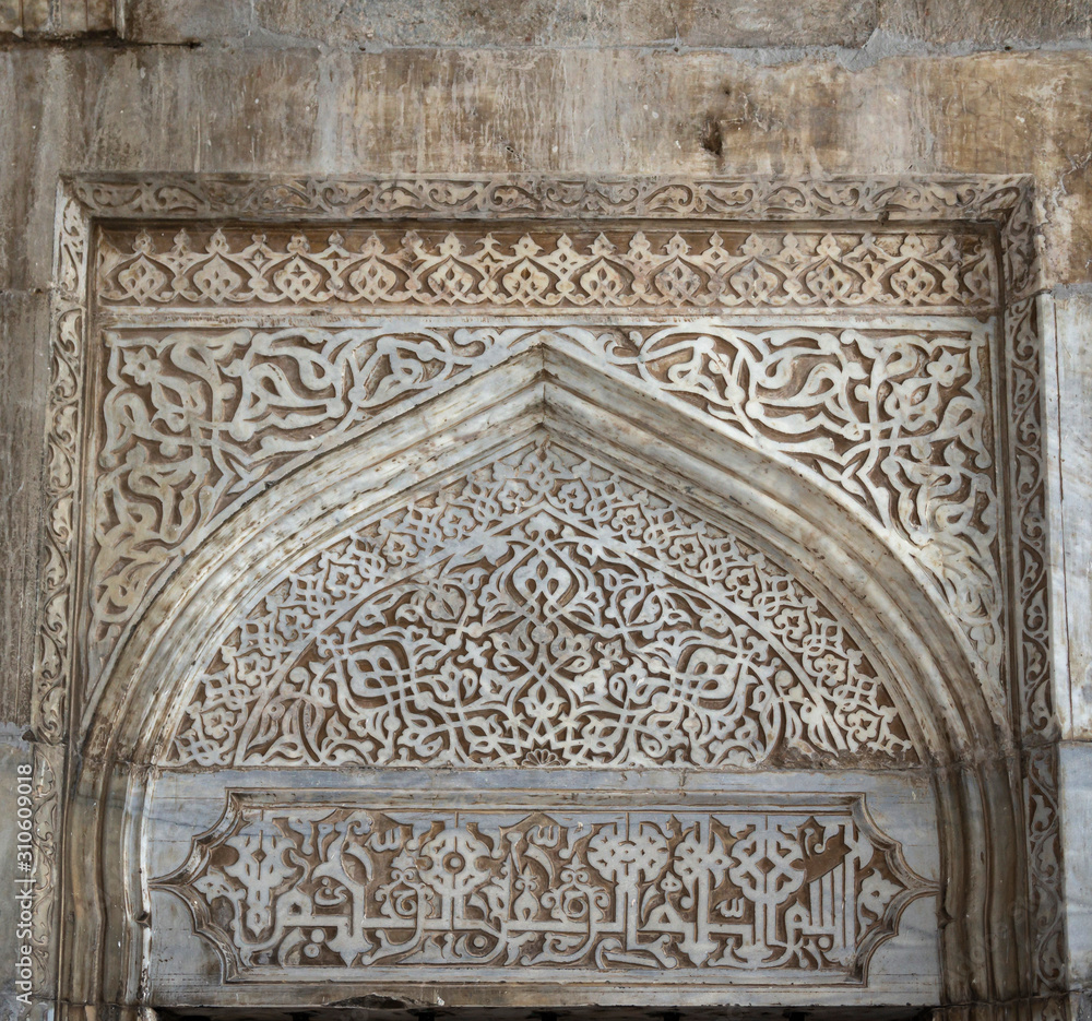 Detail of the exterior wall decoration of the Green Mosque (Yesil Cami) in Iznik, Turkey. Example of the rich stone carving ornament in traditional Ottoman style, antique islamic architecture