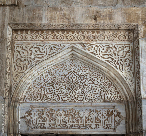 Detail of the exterior wall decoration of the Green Mosque (Yesil Cami) in Iznik, Turkey. Example of the rich stone carving ornament in traditional Ottoman style, antique islamic architecture