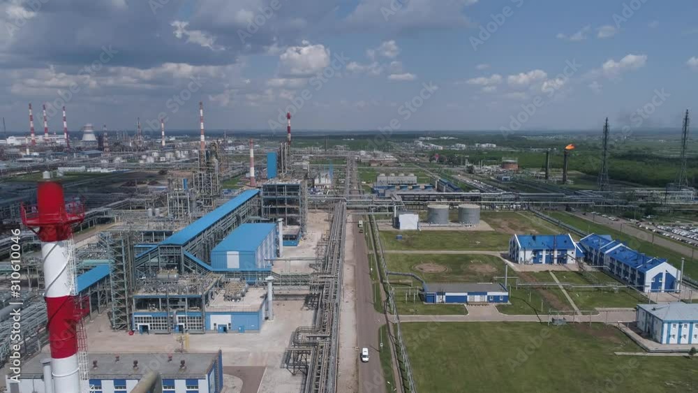 4K Aerial shot from oil tanks and towers in a refinery 4K Aerial shot from oil tanks and towers in a refinery
