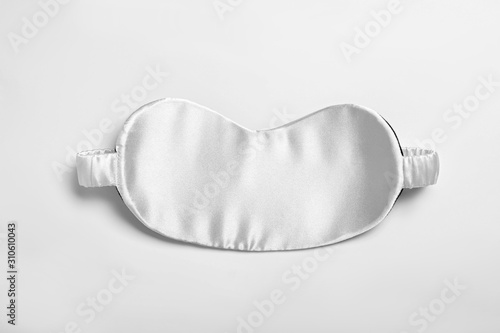 Sleeping mask isolated on white, top view. Bedtime accessory photo