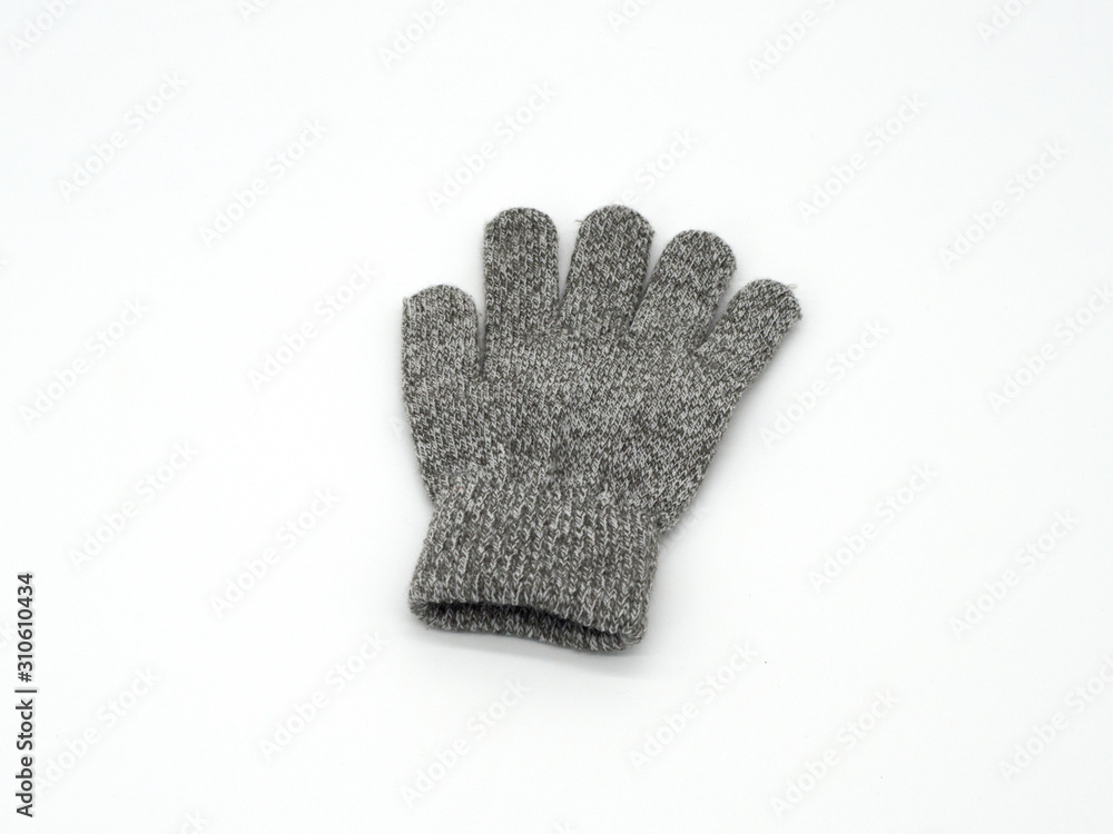 Gray children's gloves. For boys and girls. Left and right on a white background. Selective focus Gray children's gloves. For boys and girls. Left and right on a white background. Selective focus