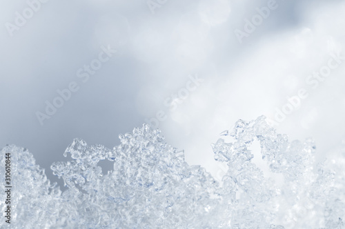 White winter snowflakes and ice close up texture pattern for designer screensaver background