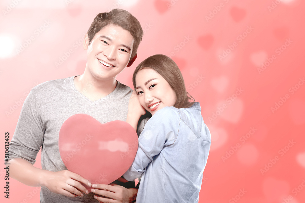 Asian couples holding the red heart Asian couples holding the red heart