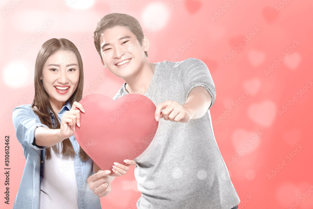 Asian couples holding the red heart