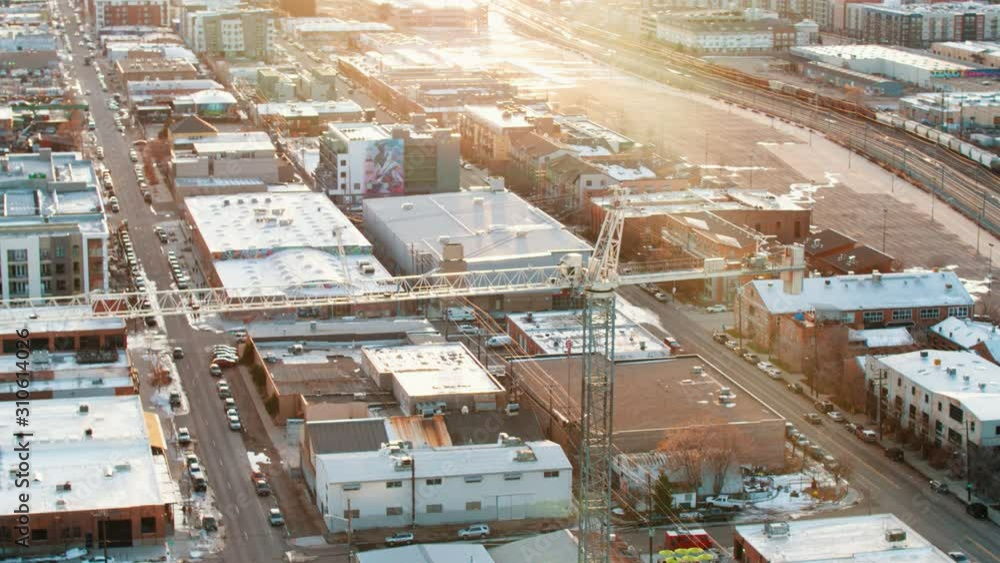 Large construction crane at development site at sunset Large construction crane at development site at sunset